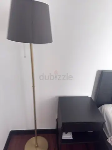 Selling 2 Slim brass floor lamps with grey fabric shade — good condition