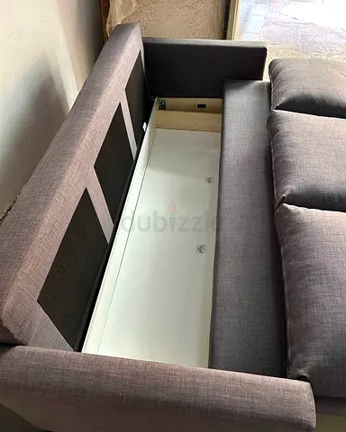 Grey fabric sofa bed with under seat storage
