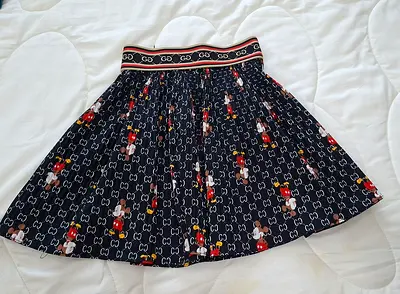 Women's designer-style pleated mini skirt with Mickey print — size  5-6 years