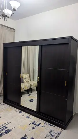 Dark Wood 3-Door Sliding Wardrobe with Mirror - Good Condition