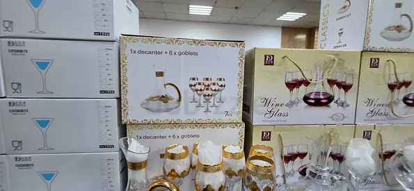 Glassware set — decanter and goblets with gold trim (new in box)
