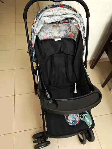 Lightweight foldable baby stroller with tray and canopy