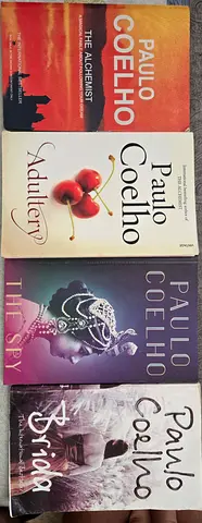 Set of 4 Paulo Coelho novels (The Alchemist, Adultery, The Spy, Brida)