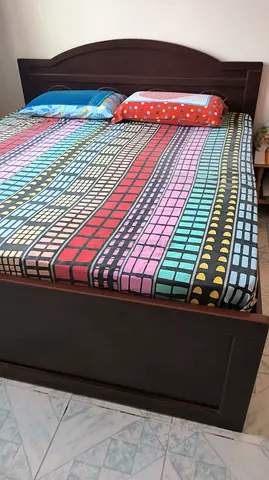 Solid wood double bed (including medical mattress) with headboard and storage base - good condition