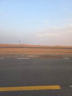Commercial land plots for sale in Al Qasimia City, Phase 3, directly on the main road.
