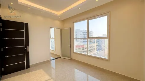 Two bedroom apartment with living room private parking premium finishing easy access to Dubai and Sharjah flexible payment options