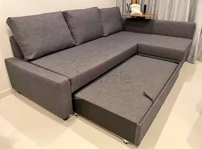 Grey L-shaped Sofa with Pull-out Bed - Good Condition