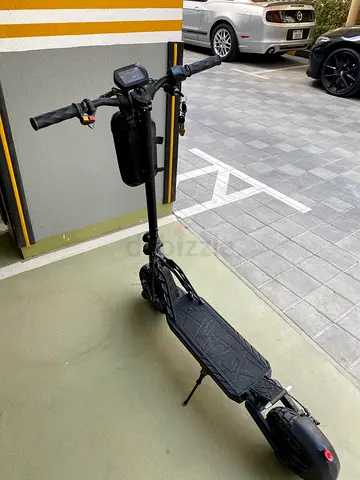 Well-maintained electric scooter with display and rear suspension