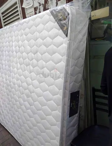 Almost-new single mattress, clean white quilted surface