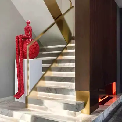 Modern Red Textured Sculpture of Seated Long-Legged Figure