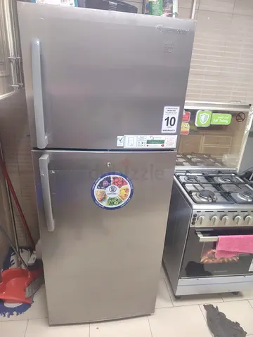 Silver top-freezer refrigerator - good working condition