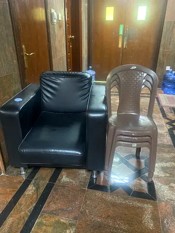Single black leather armchair in good condition