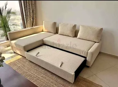 Beige L-shaped Sofa with Pull-out Bed and Storage - Good Conditio