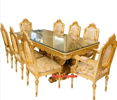 Ornate Gold 8-Seater Dining Table with Glass Top and Upholstered Chairs