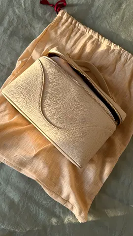 Cream textured leather small handbag with dust bag
