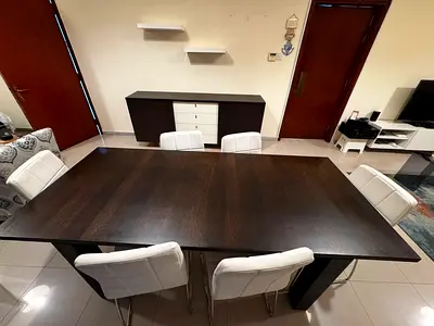 Solid dark wood dining table with 6 white upholstered chairs (sets included)