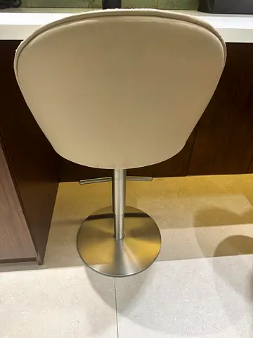 Cream swivel bar stool with metal base