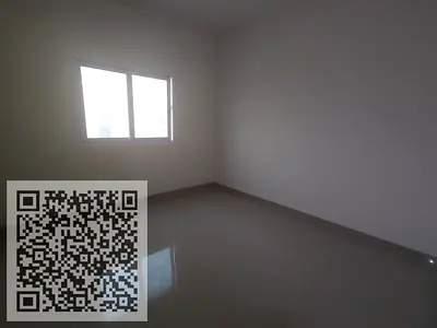For annual rent in Ajman, Al Jurf 3: Two bedrooms and a living room with three bathrooms, master bedrooms, and built-in wardrobes.