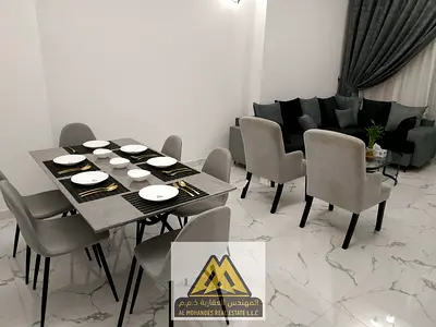 Two bedrooms and a living room / Large space / Balcony with sea view / Al Waha Towers Al Rashidiya 1, next to all services and main roads