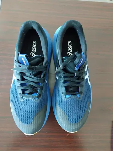 Blue ASICS running shoes