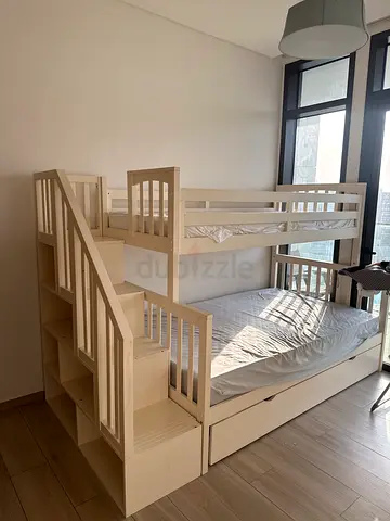 White wooden bunk bed with storage stairs — good condition