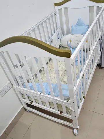 White Wooden Baby Crib with mattress and bumbers - Good Condition