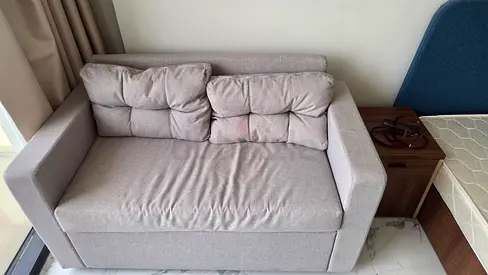 Two-seater light grey fabric sofa - compact, good condition