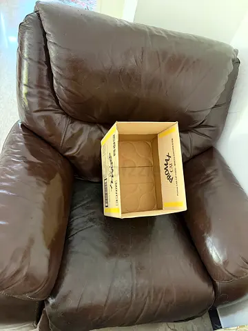 Used brown real leather manual recliner - comfortable single seat