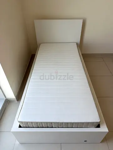IKEA single bed frame with IKEA 90x200 spring mattress.