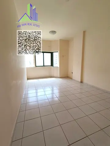 2-bedroom apartment in Al Nahda, Sharjah, featuring a balcony, 2 bathrooms, separate living room and kitchen, in a prime location closest to Dubai.