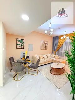Sharjah Al Taawun, two-bedroom apartment with living room, kitchen, and two bathrooms