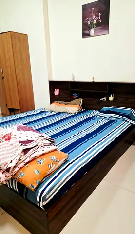 King size bed with mattress .headboard storage in dark wood - good condition