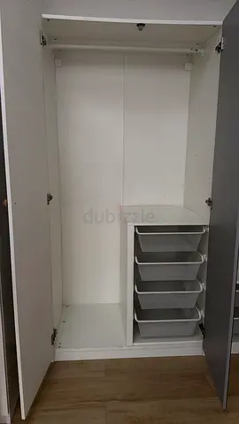 White wardrobe with internal shelves and pull-out trays, perfect condition