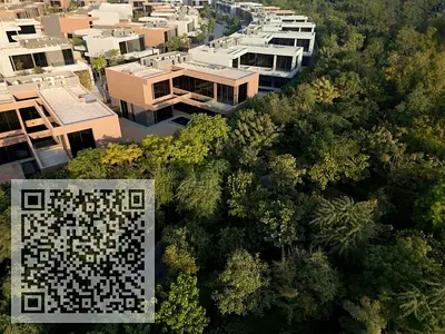 Own a 3-Bedroom Townhouse in Masaar Sharjah, surrounded by lush forests.