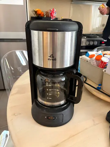 Black stainless drip coffee maker with glass carafe