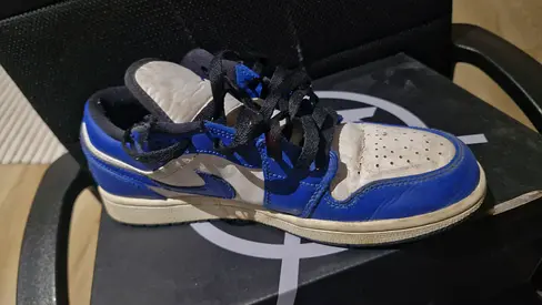 Used blue and white Nike-style low top sneakers