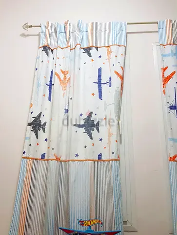 Pair of Home Centre kids curtains for Aed 150