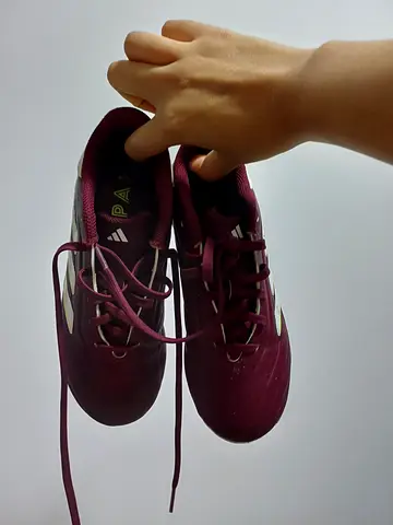 Maroon Adidas football/soccer cleats, size unknown, gently used