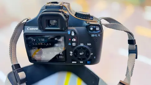 Canon EOS DSLR camera body with strap - good working condition