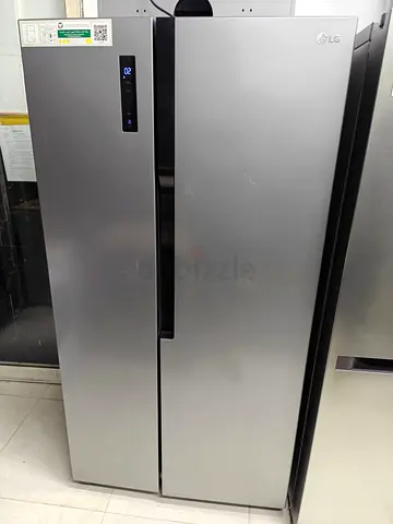 Lg side by side fridge and freezer new model slightly used