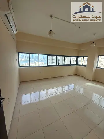 **Al Majaz 3 | 2-Bedroom Apartment with Living Room in a Prime Location**