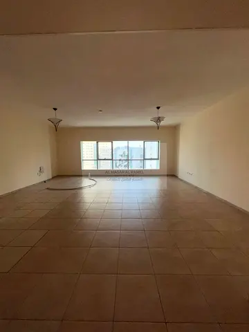 A spacious and comfortable 3-bedroom apartment with a living area, featuring a practical layout and family-friendly space. It is situated in a vibrant