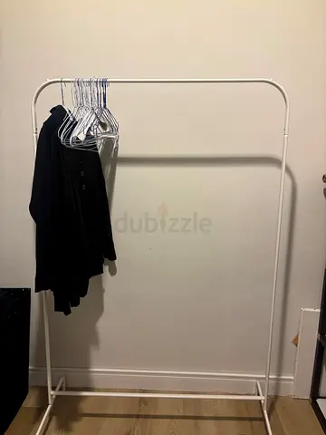 Simple white freestanding clothes rack - single rail