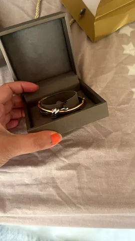 Gold-tone bracelet with bow detail in box - gently used
