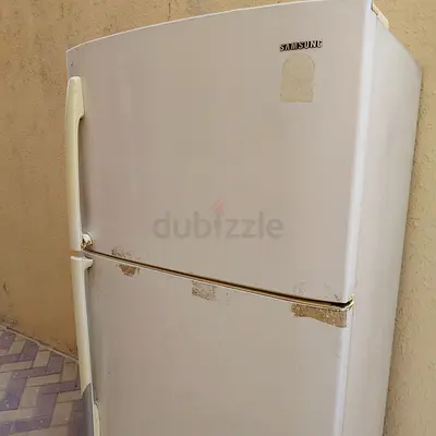 Used white top-freezer refrigerator - good working condition