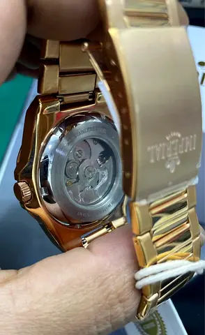 Gold-tone automatic men's wristwatch with exhibition caseback