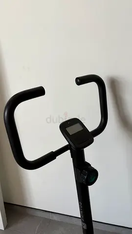 Compact upright exercise bike with digital display - lightly used