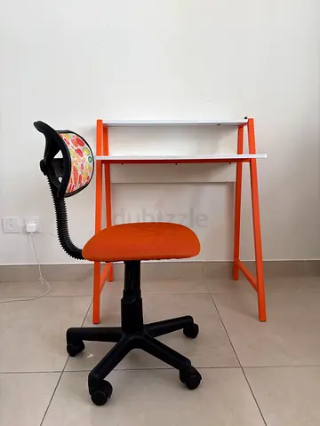 Compact orange study desk with swivel office chair - good condition