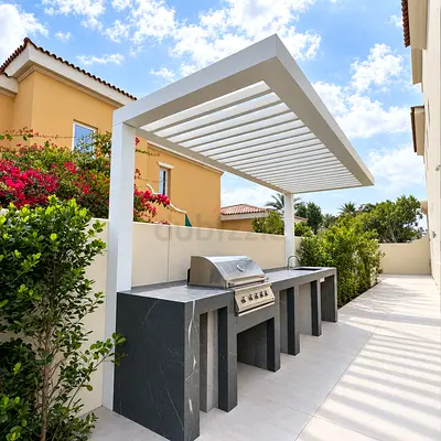 Outdoor built-in BBQ counter with pergola canopy