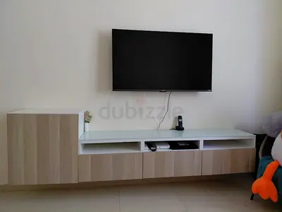 TV unit with storage cabinet - light wood finish